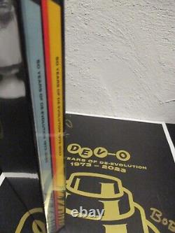 DEVO 50 Years of De-Evolution LTD ED 4LP Clear Vinyl Box Set & CD Signed Poster