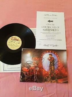 Queen bohemian rhapsody vinyl signed by Freddy Mercury and the group. C. O. A